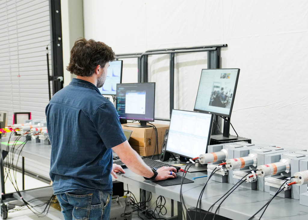 Neutron diagnostic scientist operates NAF diagnostic station.
